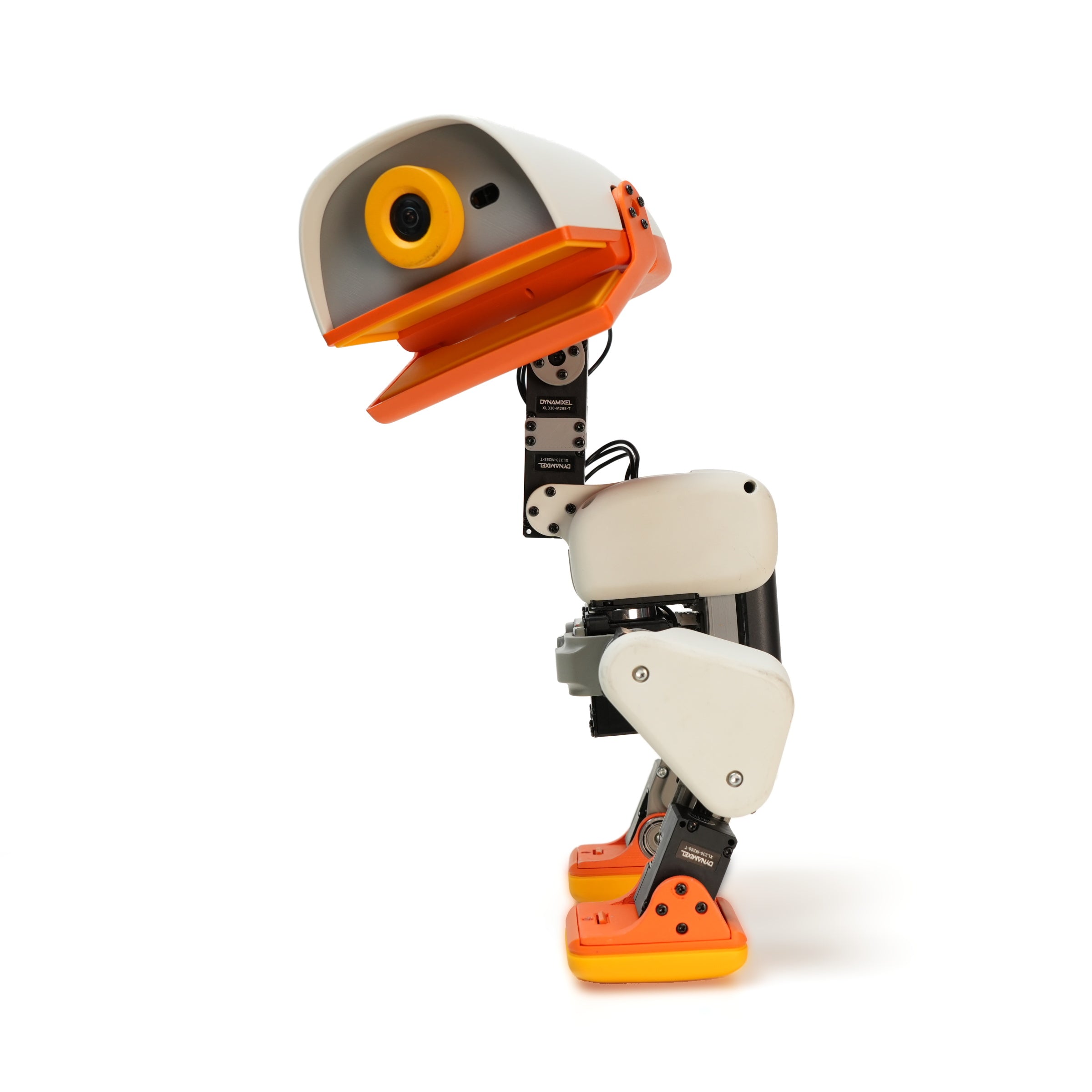 Cream Pollen Robotics Microduck biped robot standing in a left-facing profile view.